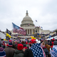 Rioters loyal to President Donald Trump rally at the U.S. Capitol in Washington on Jan. 6, 2021. A North Carolina man has become the second member of the Proud Boys to plead guilty to conspiring with other members of the extremist group to stop Congress from certifying the Electoral College vote. Charles Donohoe pleaded guilty Friday to charges of conspiracy and assaulting federal officers during an appearance in federal court in Washington.